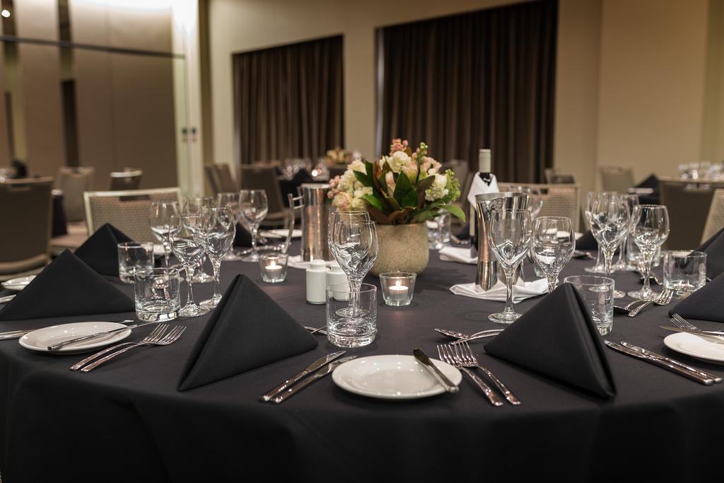 Pullman Sydney Olympic Park Sidney Exterior foto A table set for a formal dinner